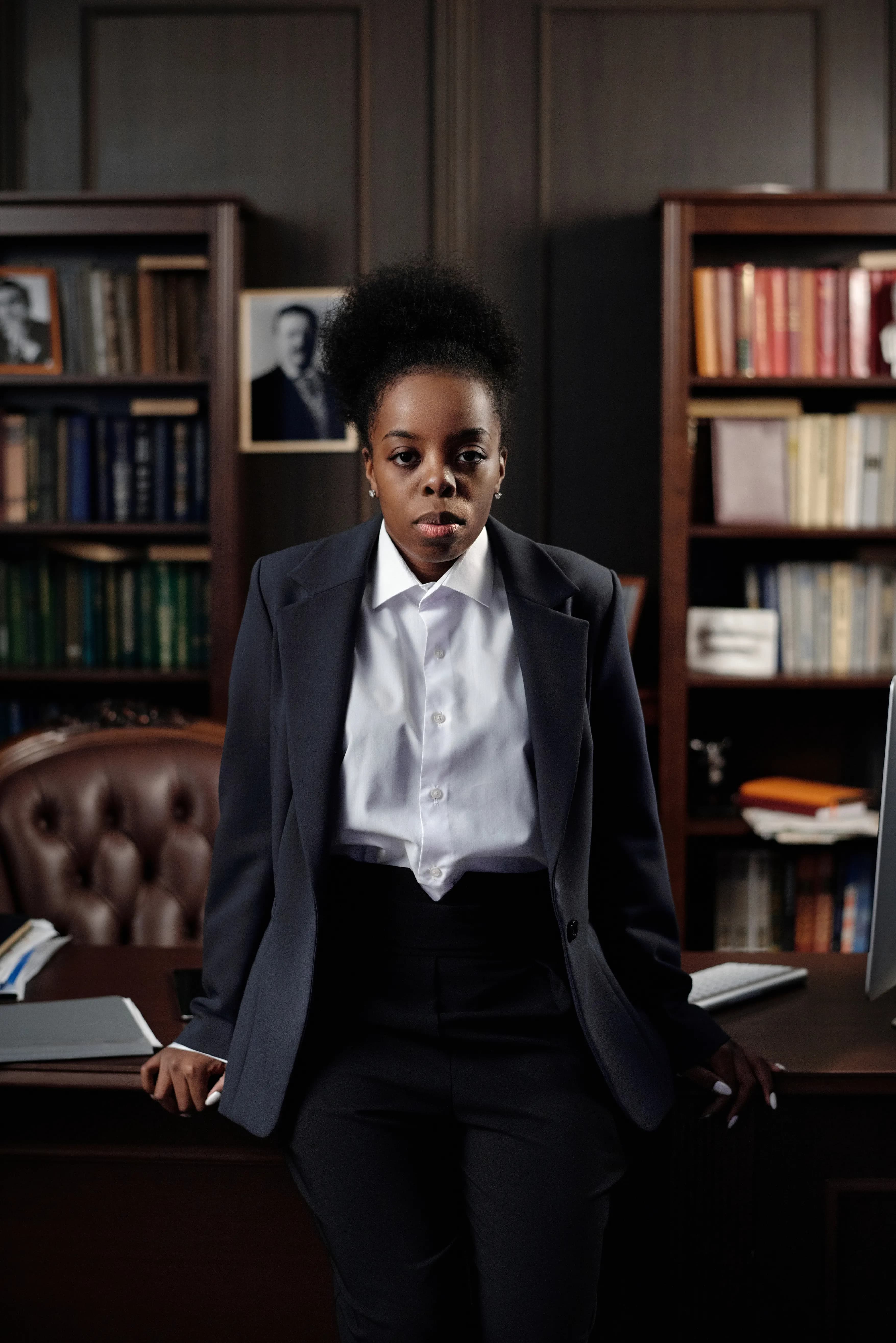 Professional Black woman standing confidently in an office