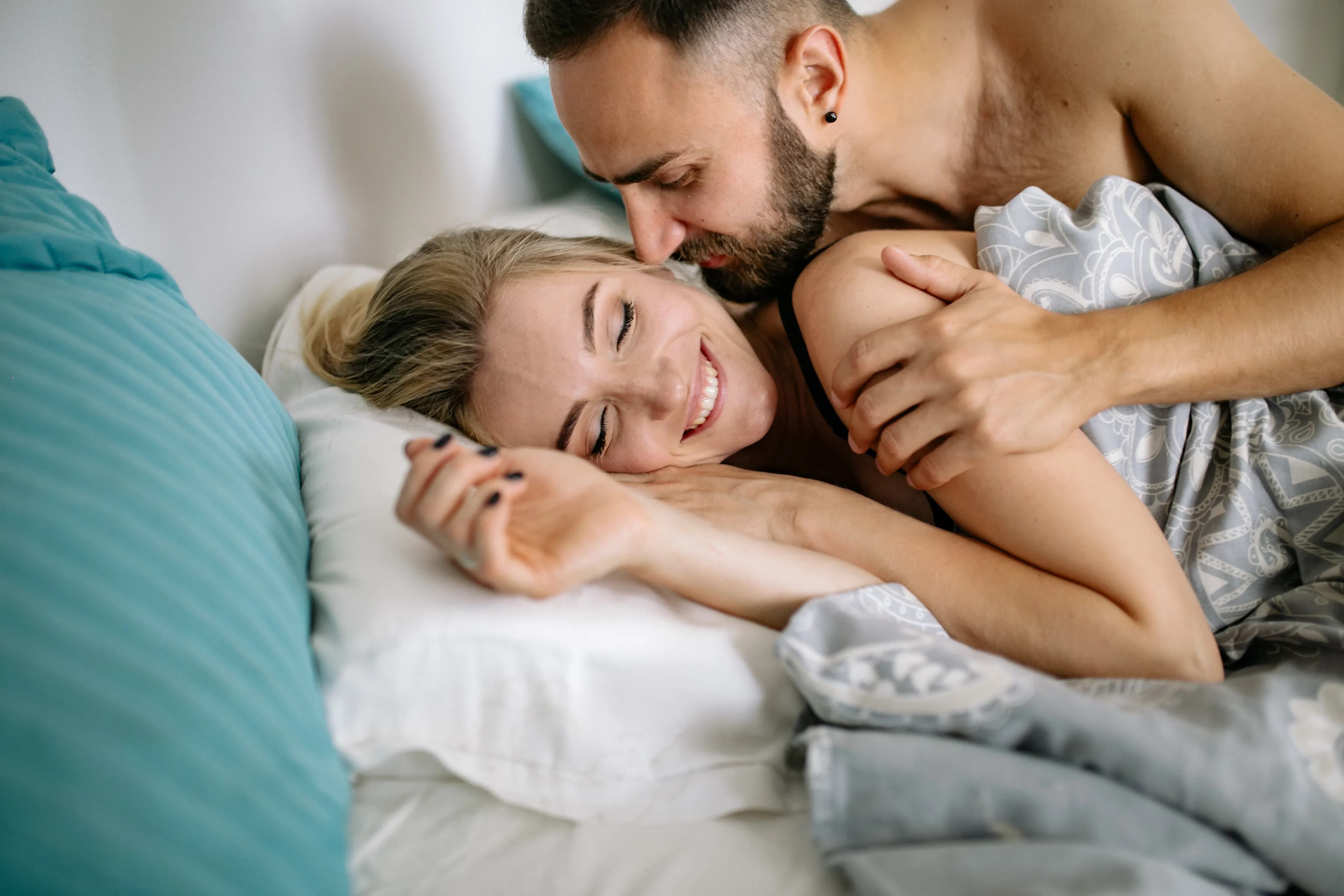 Couple cuddling together in the morning light