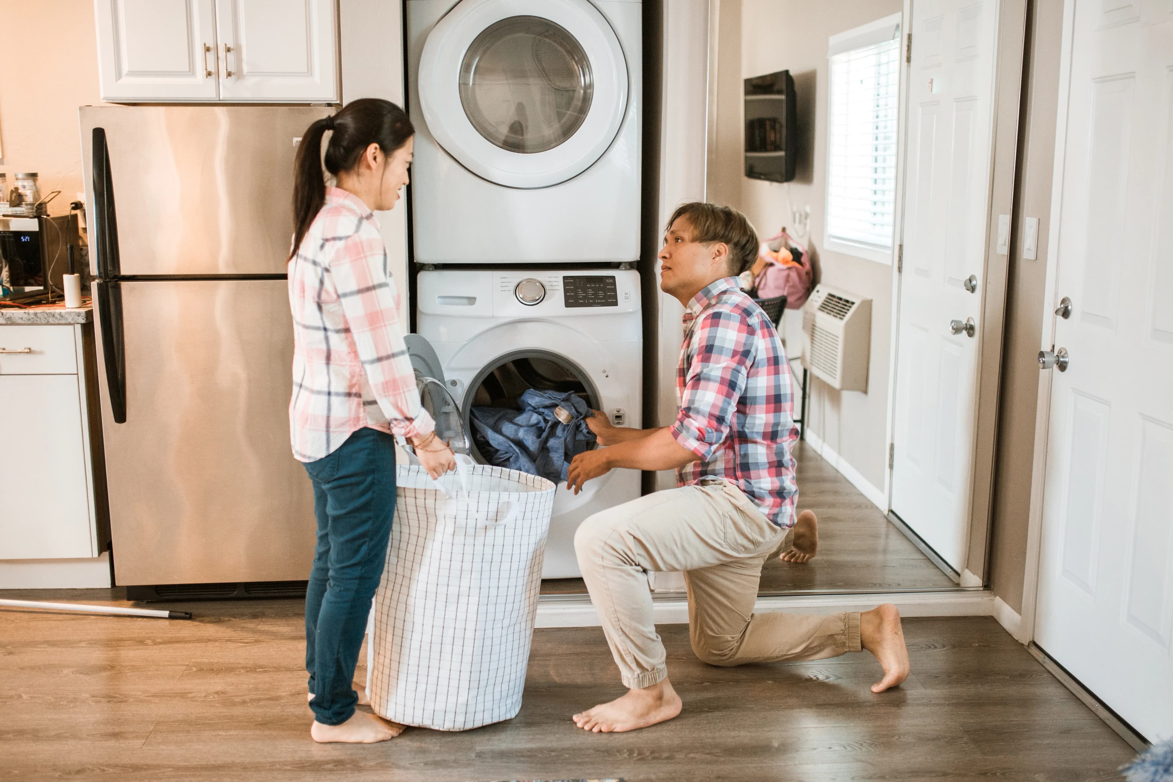 Two partners sharing the household laundry