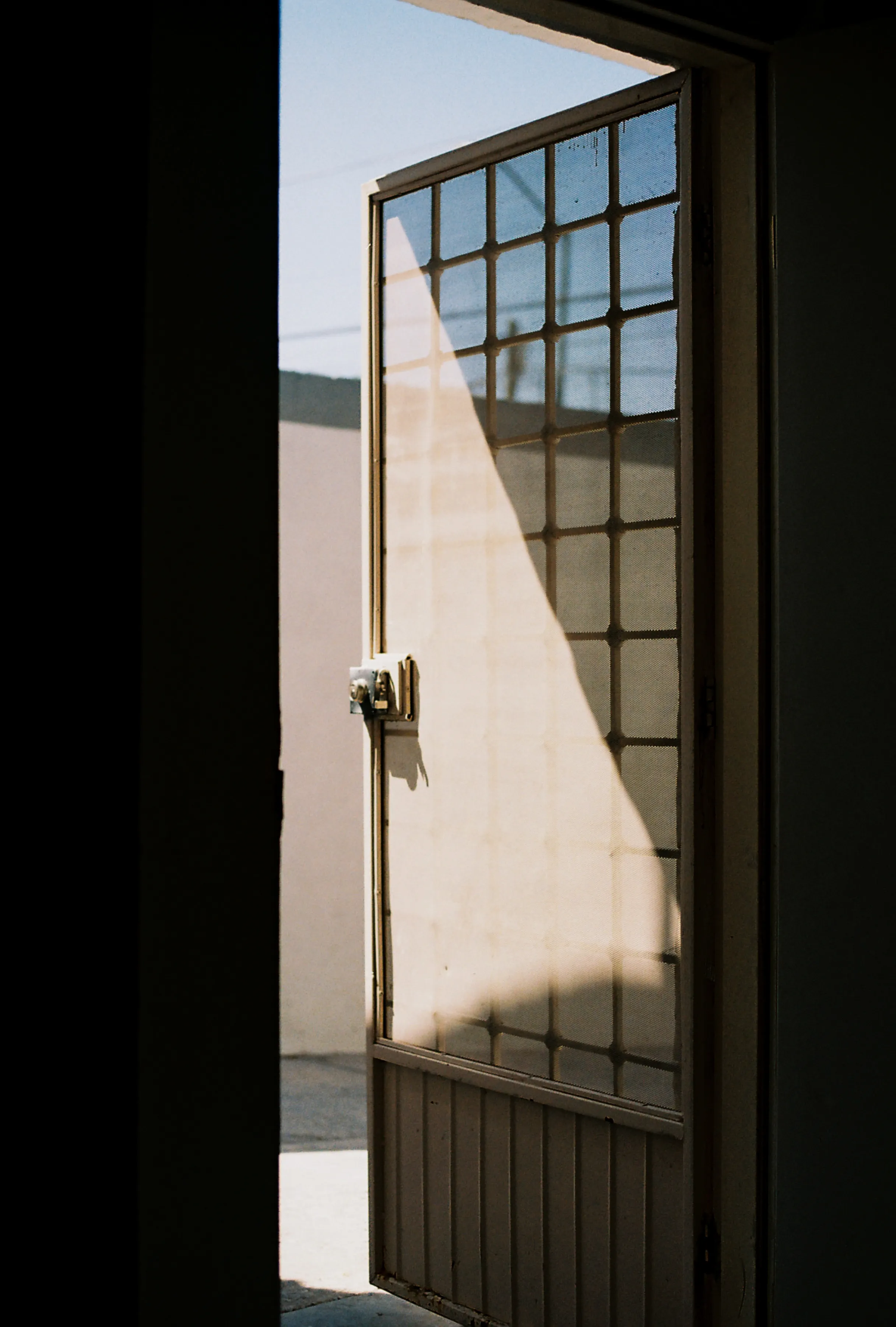 An open doorway leading into the daylight