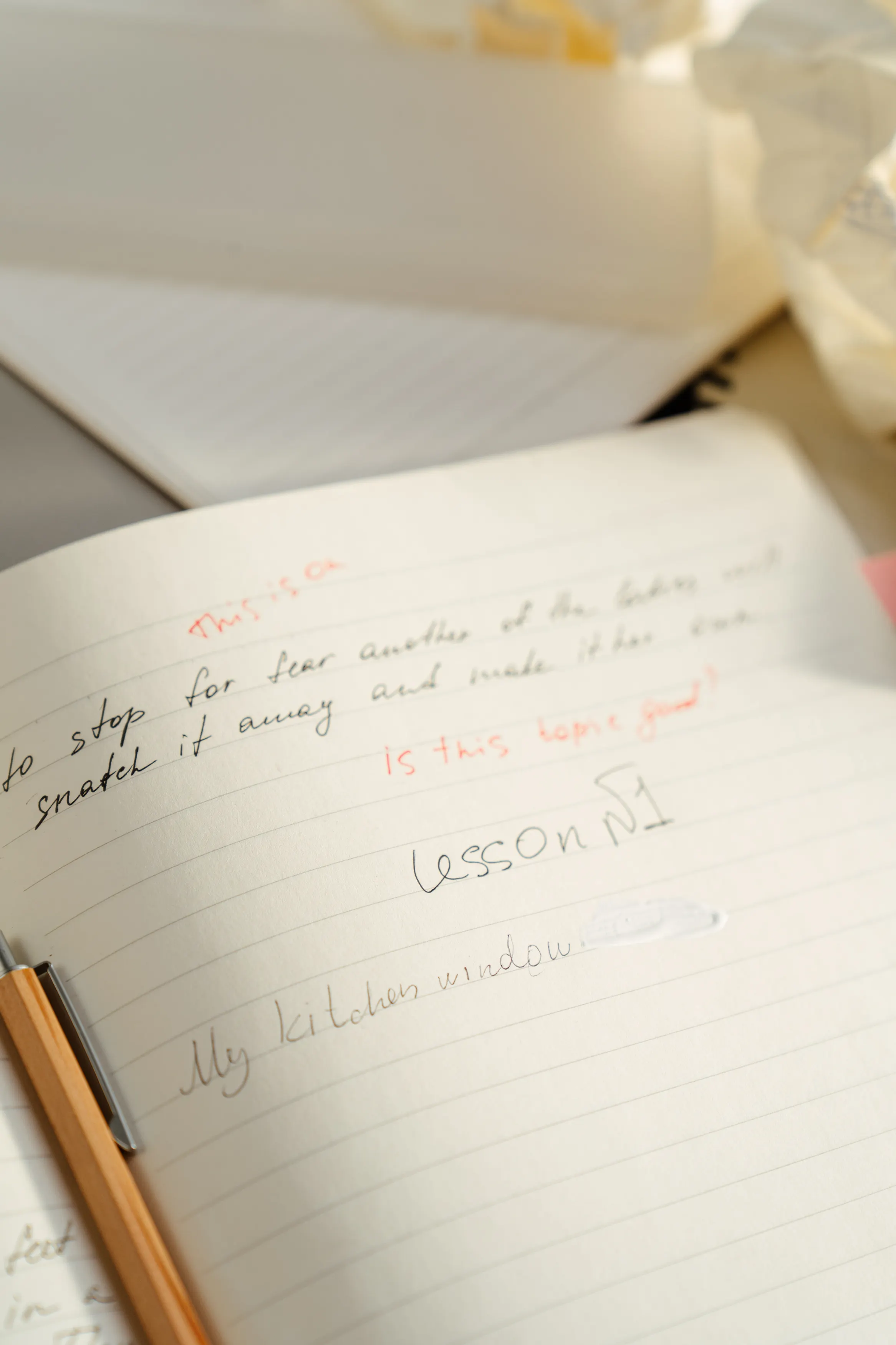 Open notebook with handwritten notes on a table