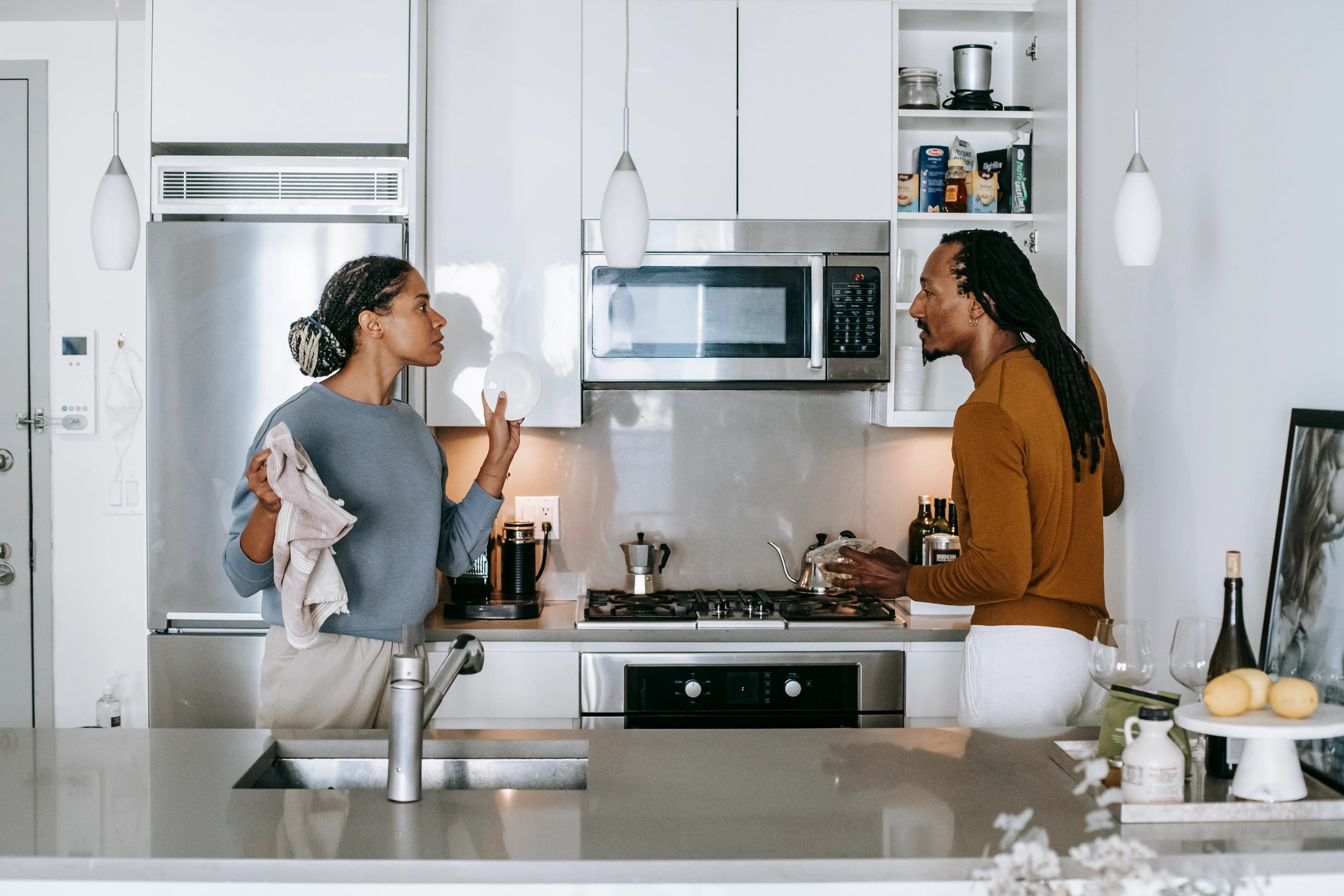 A couple discussing an issue in the kitchen