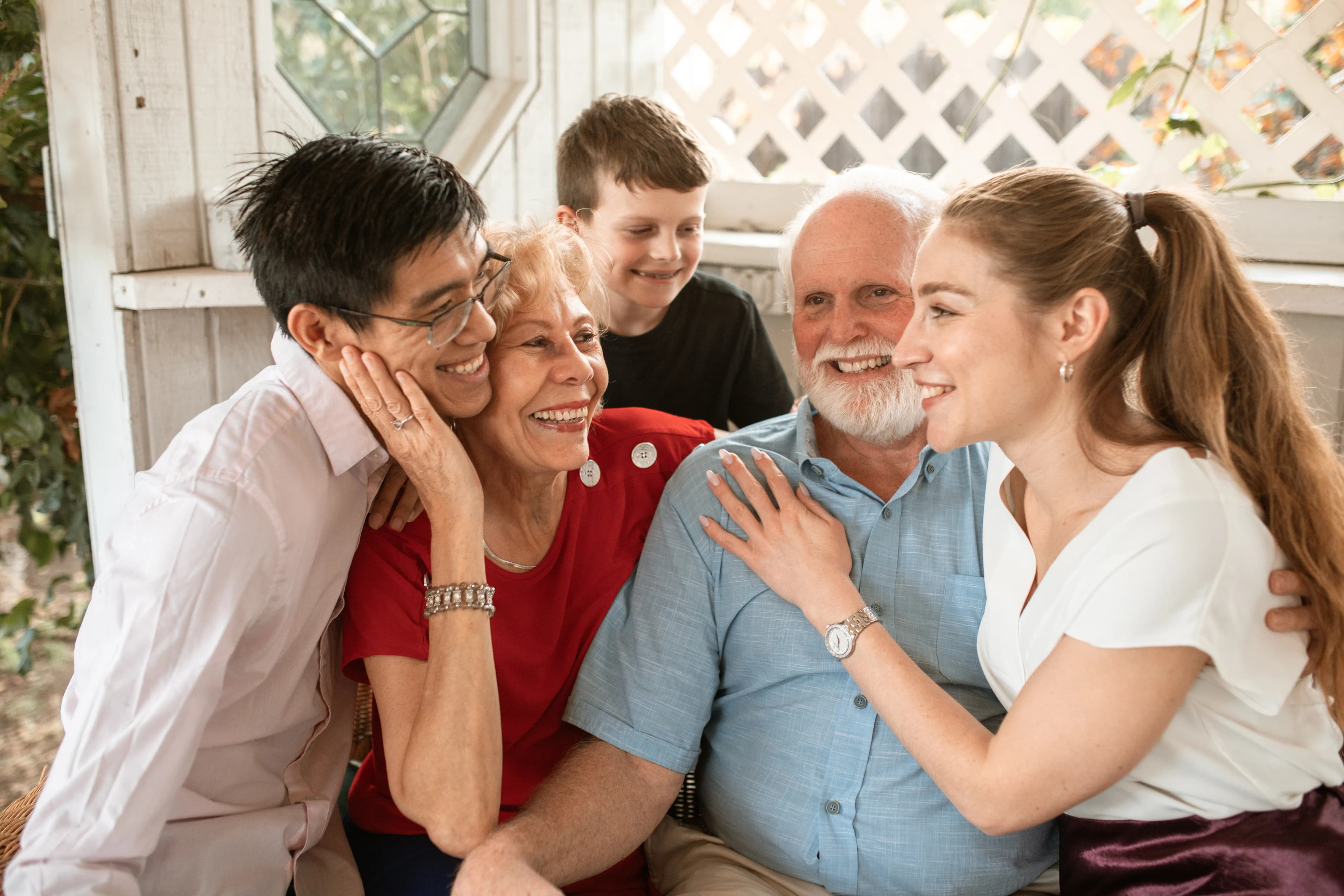 Multigenerational family embracing in a bright home