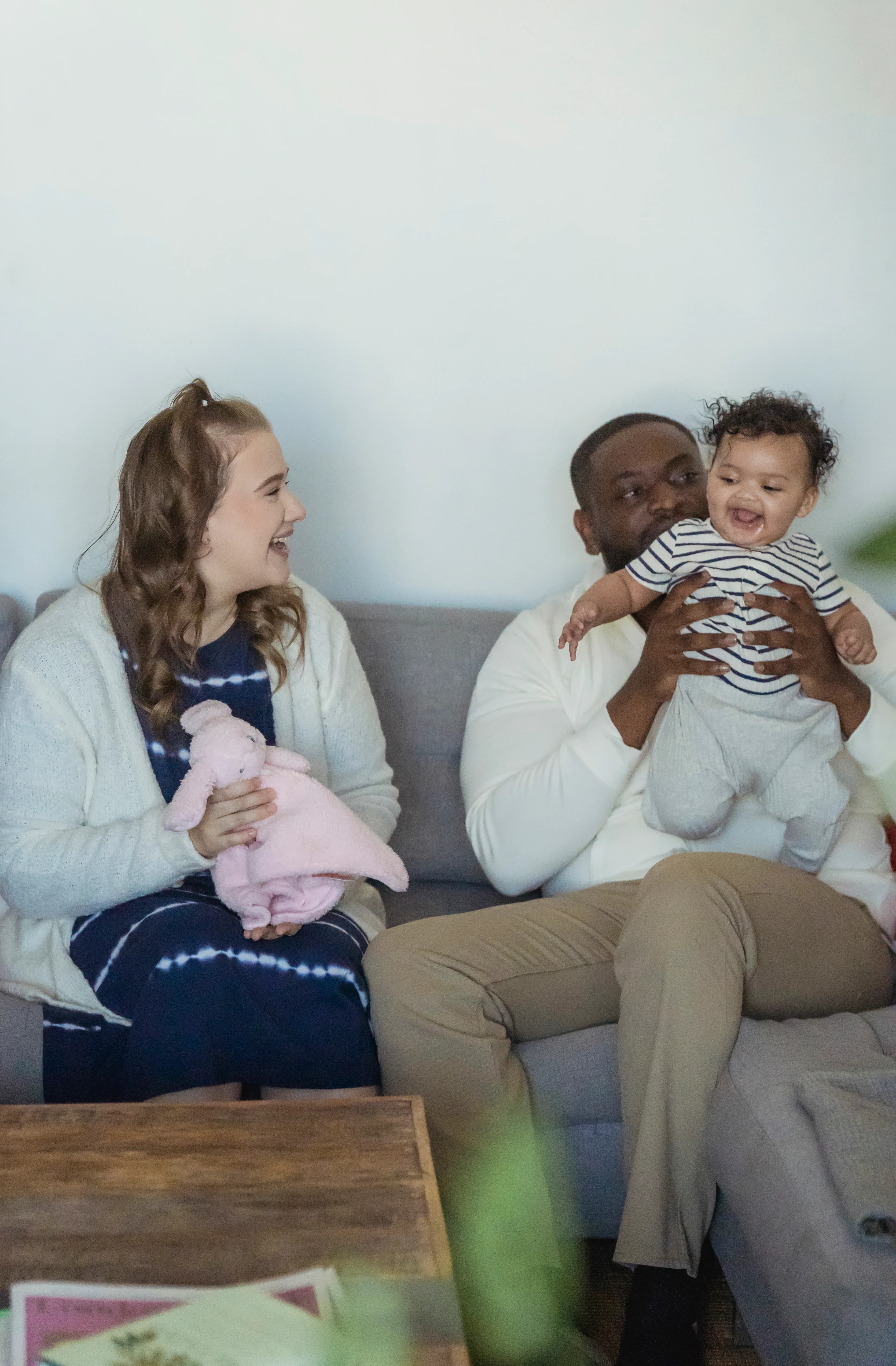 Multiracial family relaxing together in the living room