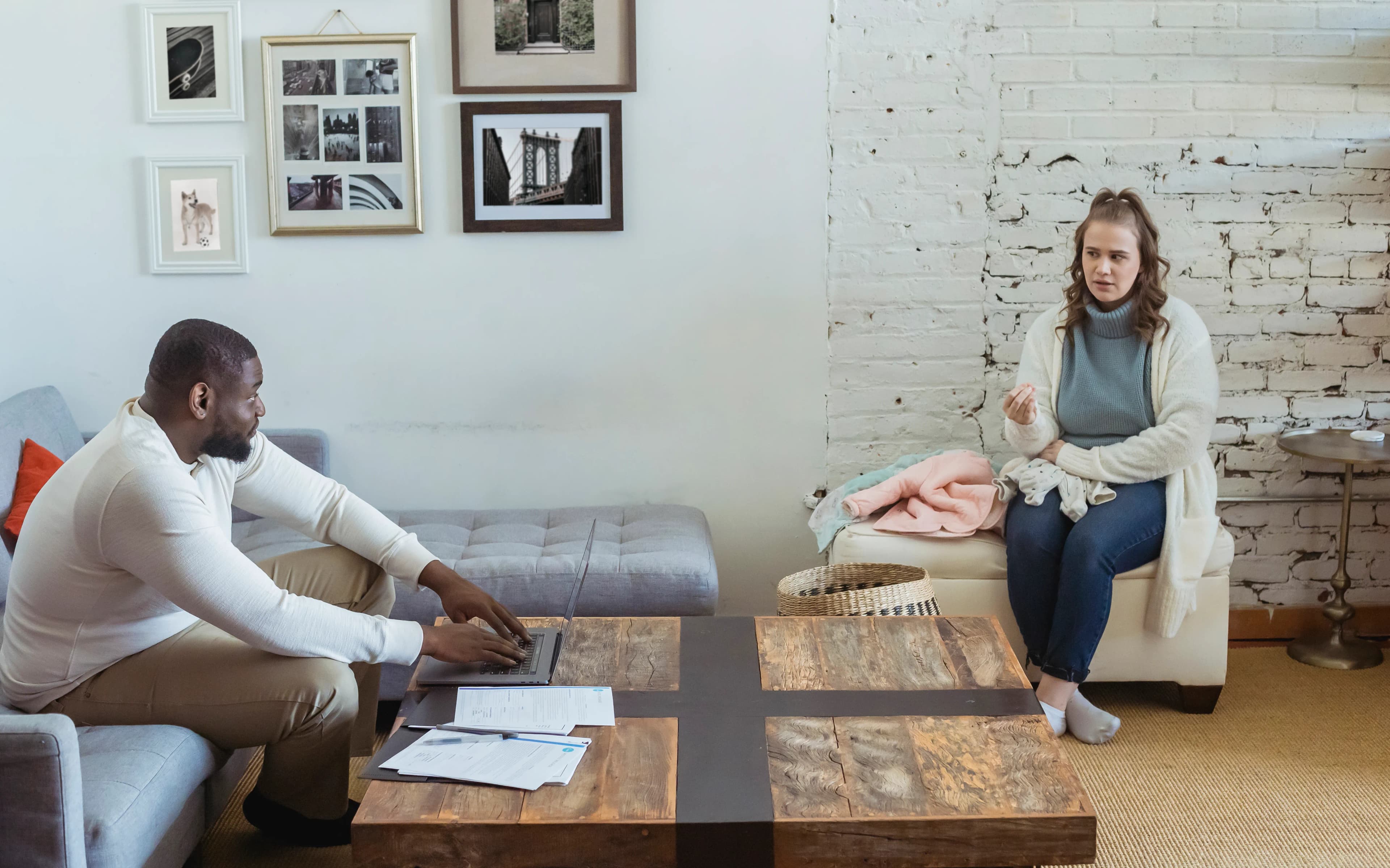 Couple sitting together to discuss an unresolved disagreement