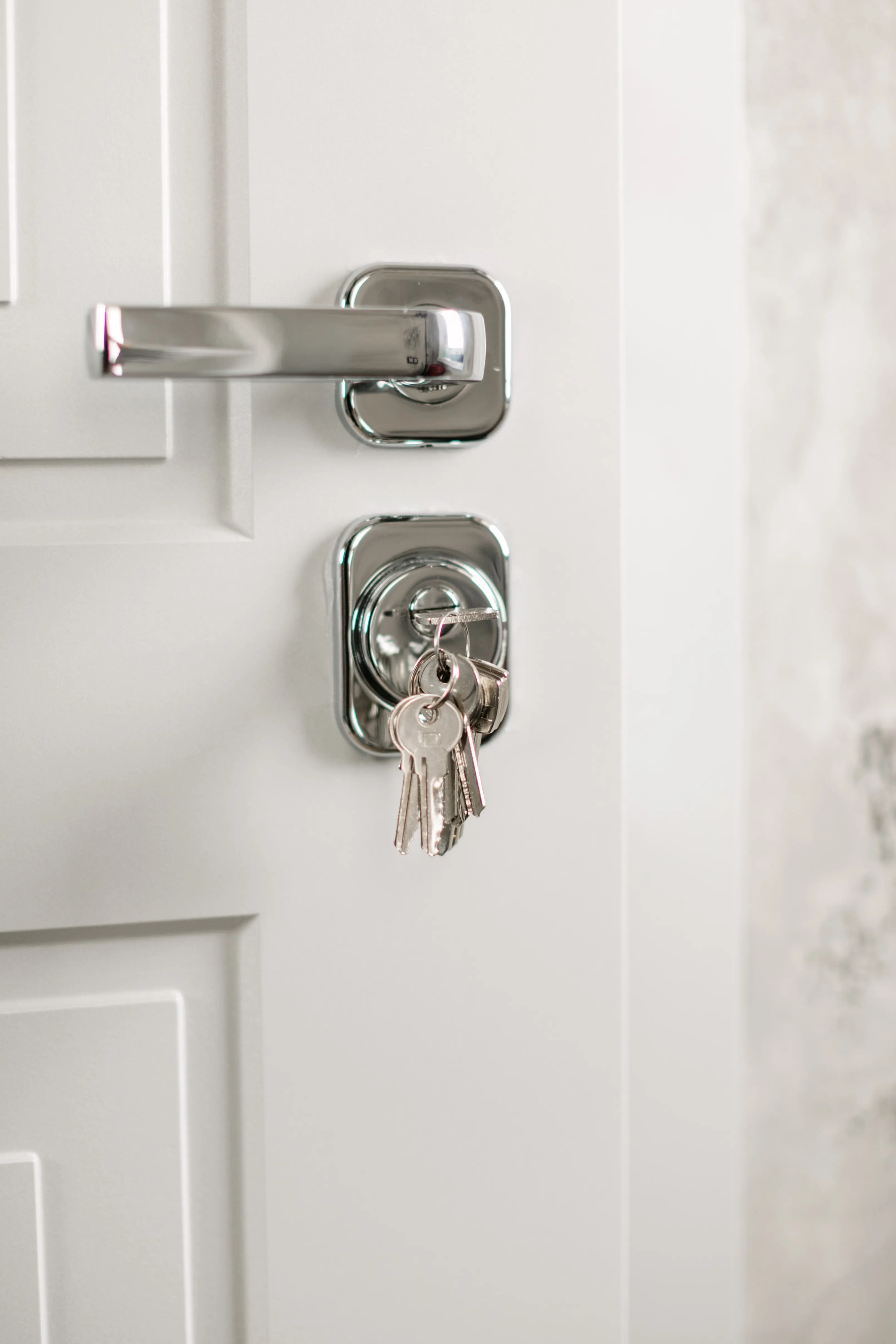 Close-up of keys in a door lock, a metaphor for boundaries