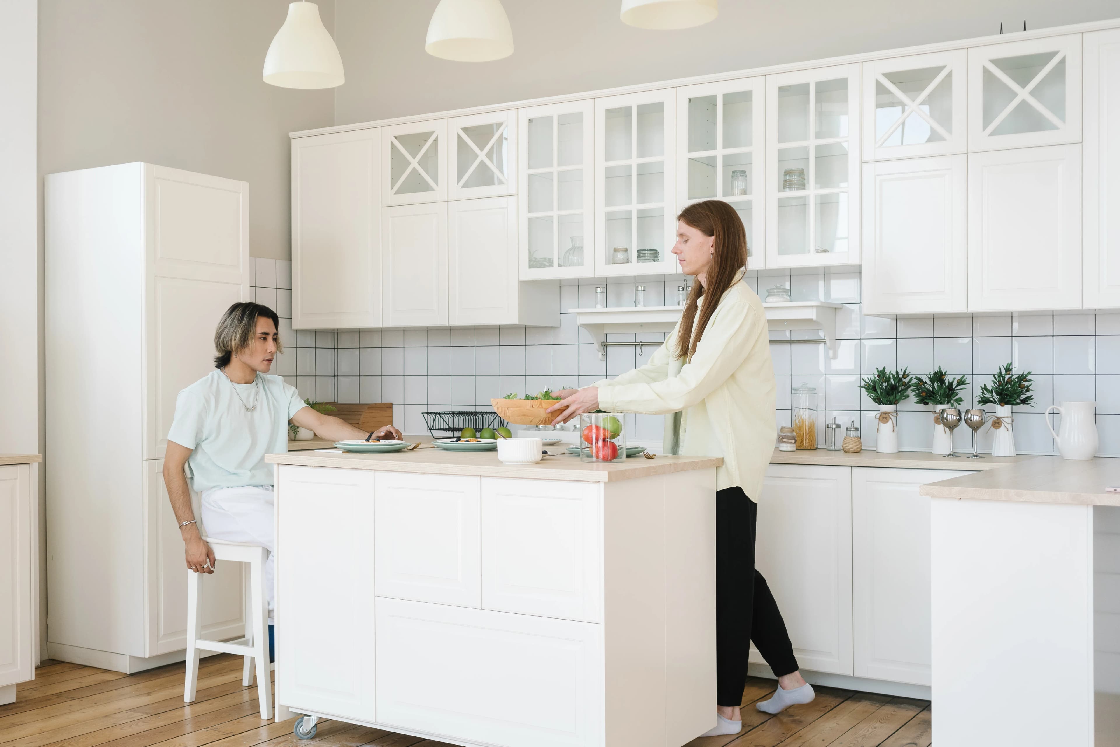 Diverse couple preparing a meal together in a bright kitchen